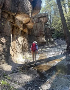 Solo hiker in a canyon near Silver City, New Mexico